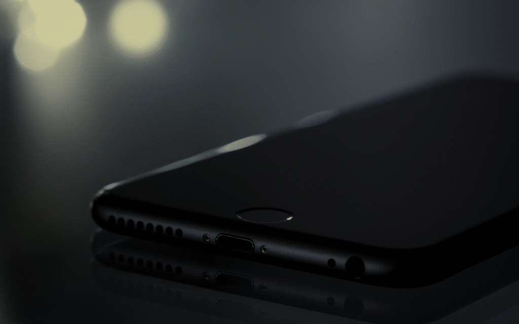 A close-up view of a smartphone's sleek black design, showcasing the device's refined and minimalist appearance.